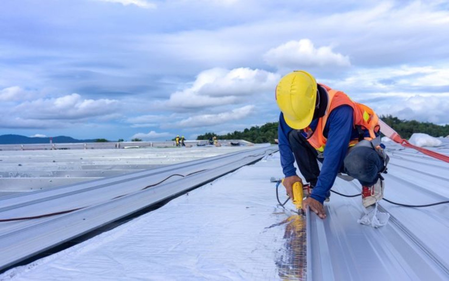 Waterproofing professional applying protective coating on a rooftop